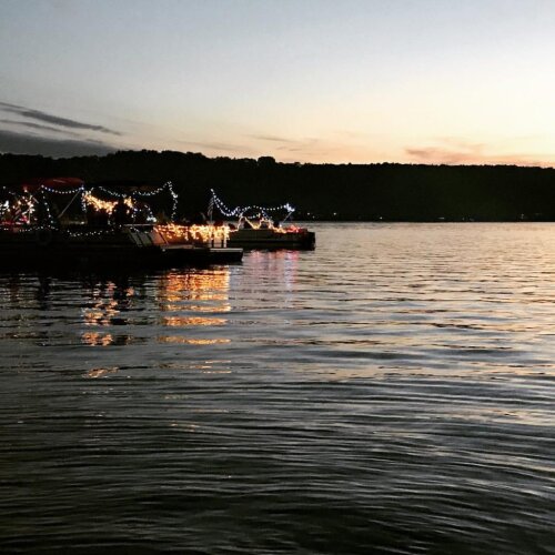 Several boats lined up on Findley Lake for the boat parade.