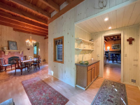 Chautauqua Farmhouse Retreat view of dining room table and fireplace