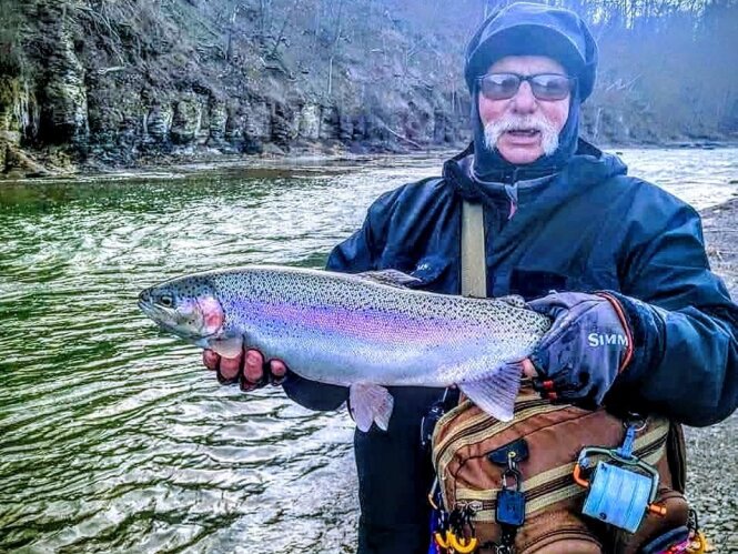 On a foggy winter morning, Gerald Brydalski captures a colorful steelhead from a Lake Erie tributary along Steelhead Alley. Brydalski is founder of the Western New York Steelheaders organization and owner of Jigmaster Jigs. Provided photo.