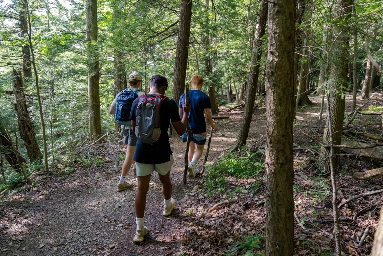 Young men hiking on trail in Chautauqua County New York