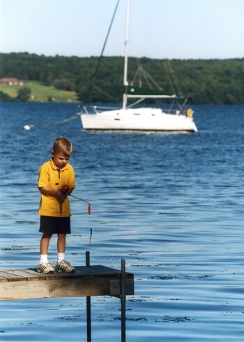 Child fishing off dock Chautauqua Lake
