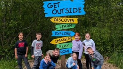 Children by signs at Audubon