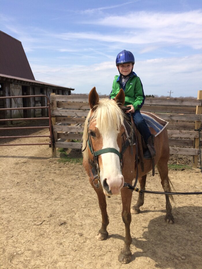 Kid Riding a Pony at Double D.A.B. Stables