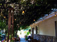 Merritt Estate Winery front of building closeup tables and chiars