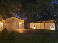 Maple Bay Get a Way garage and fence at night