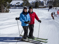 Skiers at Peek'n Peak Resort smiling at bottom of slope