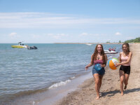 Women walking on Sunset Bay Beach Lake Erie in background web