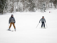 Adults skiing at Peek'n Peak