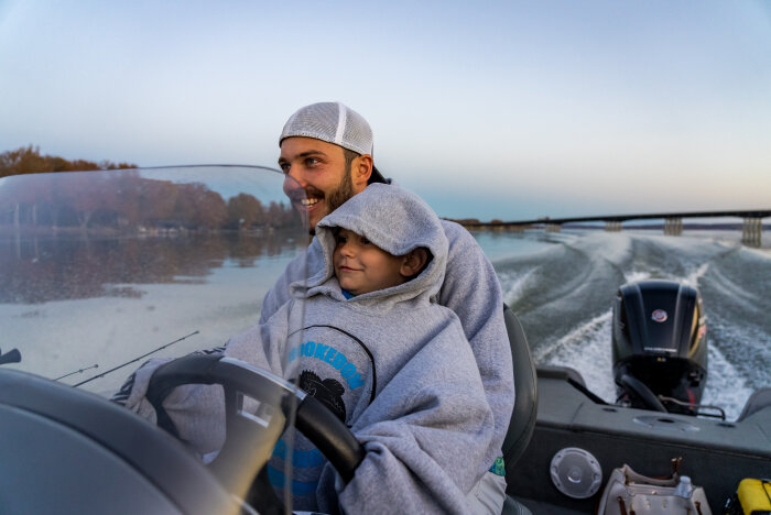 father and son fall boating