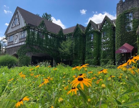 Summer flowers surround the exterior of the Inn at Peek'n Peak