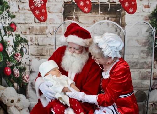 Santa and Mrs Claus photo with baby