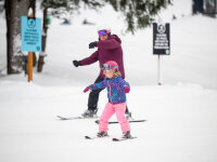 Peek'n Peak Child Learning to Ski with Adult