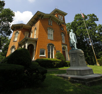 Fenton History Center exterior with statue